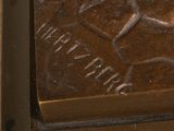 a close up of a bronze statue of a man