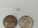 three coins are shown on a white surface with a price tag