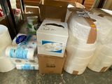 many rolls of toilet paper and rolls of toilet paper on the floor