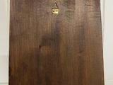 an image of a piece of wood with a gold triangle on it