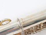 a close up of a flute that is on a white surface