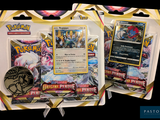 Deux paquets de cartes à collectionner Pokémon sont exposés sur une table.