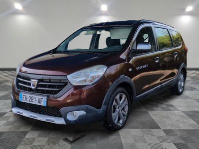 the brown van is parked in a large room with a checkered floor