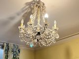 a chandelier hanging from the ceiling in a room
