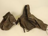 pair of old brown leather bags on a white surface
