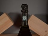 a bottle of wine that is sitting on a table