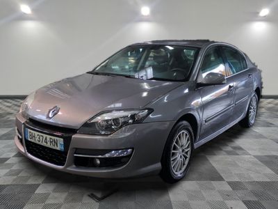 a picture of a silver car parked in a showroom