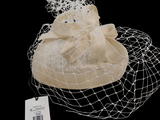 a white hat with a veil and a tag on it