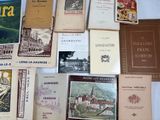 many books that are sitting on a table together