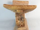 an image of a wooden bowl on a stand on a white background