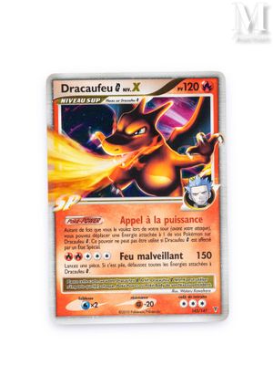 a close up of a pokemon card on a white surface