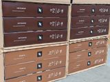 several cardboard boxes stacked on top of each other on a sidewalk