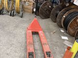 a forklift in the middle of a warehouse filled with lots of different types of equipment