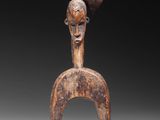 an image of a wooden sculpture of a woman ' s head