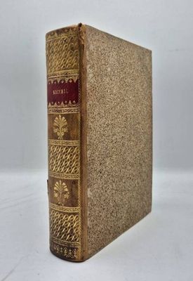 un livre marron aux bords dorés et à la couverture rouge