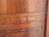 a close up of a wooden door with a clock on it