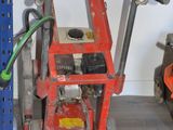 an image of a garage with tools on the floor