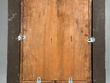 an old wooden picture frame with metal studs on a white background