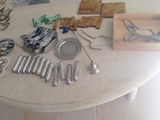 a table with a lot of silverware on top of it
