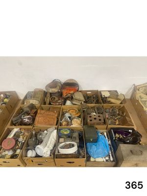many boxes of assorted items sitting on the floor