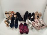 several pairs of women ' s shoes are lined up in a row