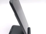 a cell phone that is sitting on top of a stand