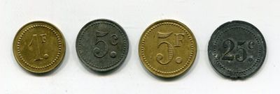 three different types of coins are shown on a white surface