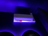 a purple light that is on the ceiling of a room