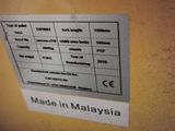 a sign on the wall that says made in malaysia