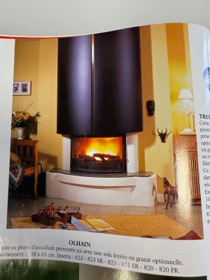 an open book with a picture of a fireplace in it