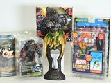 three action figures on the table next to each other