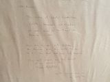 a piece of paper with writing on it sitting on a table