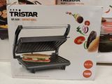 a box with a sandwich inside of it on the counter