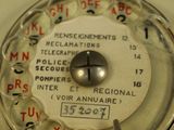 a close up of a dial on a white toilet