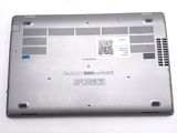 a silver laptop with a blue sticker on it