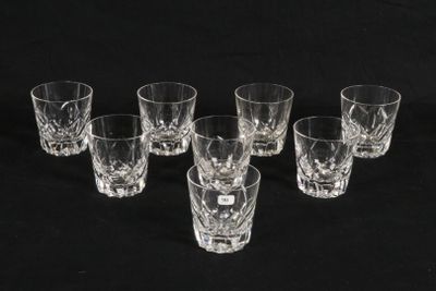 six shot glasses are lined up in a row on a black background