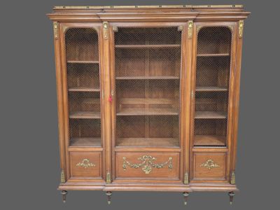 an image of a wooden bookcase with glass doors and drawers