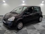 a picture of a small black car parked in a garage