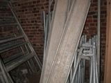 several pieces of wood are stacked on top of each other in a room