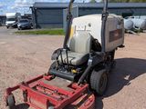 an image of a lawn mower parked in a parking lot
