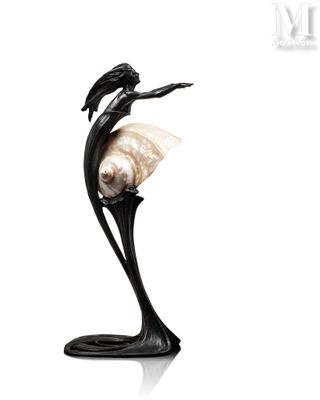 a statue of a woman with a shell in her hand