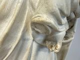 a statue of a woman holding a baby in her arms
