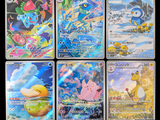 several pokemon cards are displayed in a row on a black background
