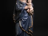 a statue of a woman holding a child in her arms