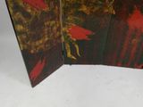 a three panel screen with a red bird on it