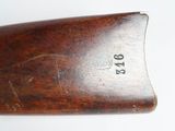 an old wooden rifle with a wooden handle and a wooden barrel