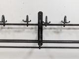 a picture of a metal rack with hooks on it