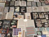 a lot of stamps and stamps on the table