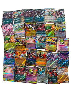 a pile of pokemon cards sitting on top of each other