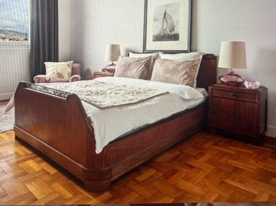 a picture of a bedroom with wood floors and a large bed